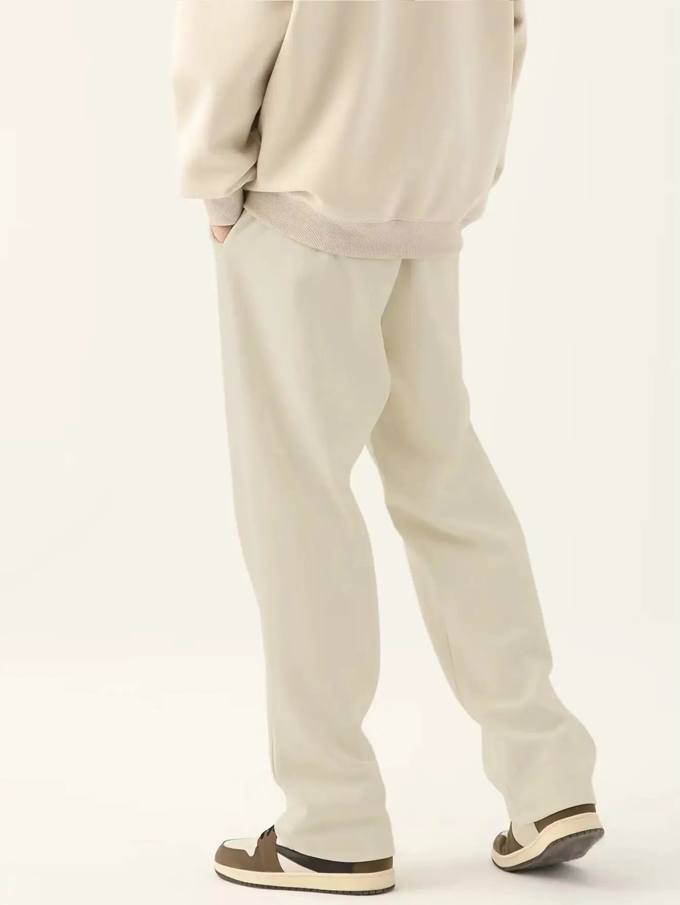 Men's beige baggy jogging pants with relaxed fit for a neutral look