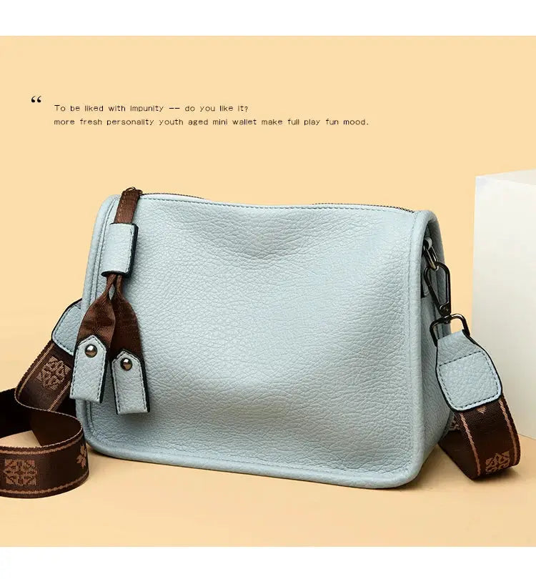 Simples Market genuine leather women's tote bag in light blue with brown crossbody strap
