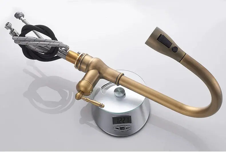Simples Market antique bronze kitchen faucet with pull-out sprayer.
