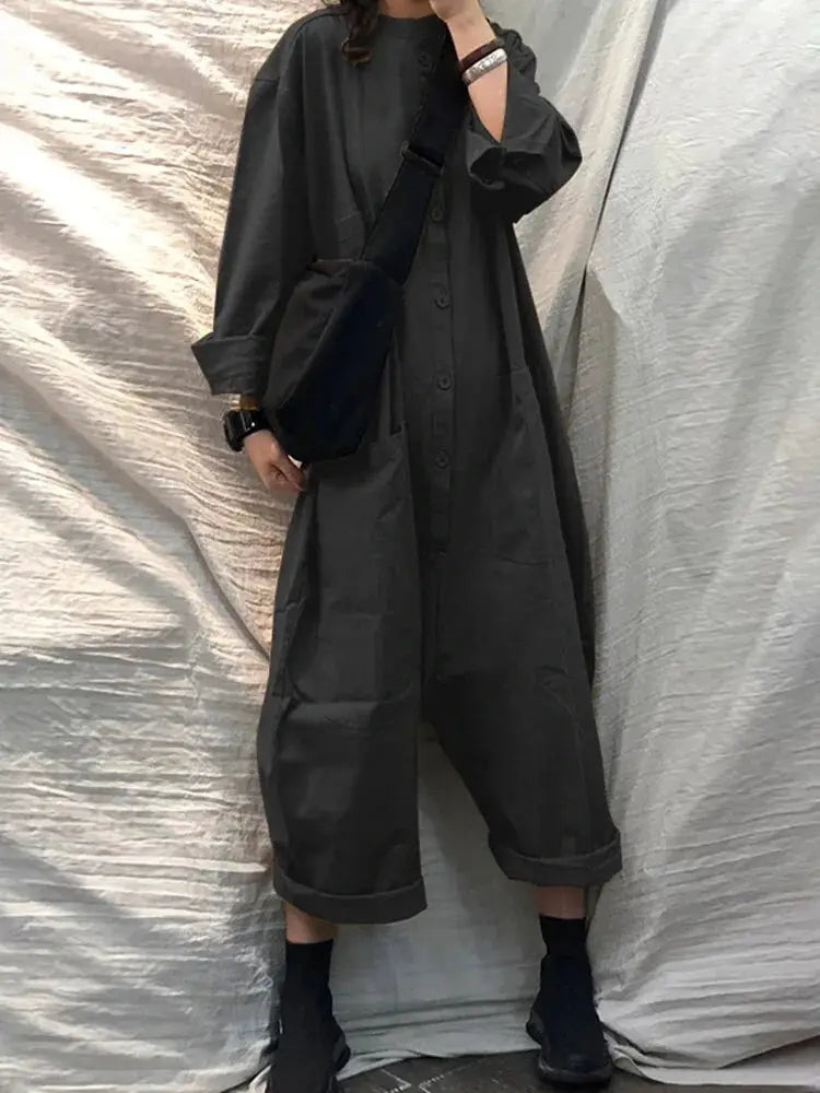 Charcoal gray pocket jumpsuit for women, loose fit with long sleeves and rolled cuffs, button front