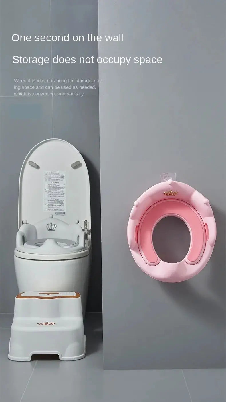 Baby and child toilet seat set with white toddler potty and pink wall-mounted ring seat.