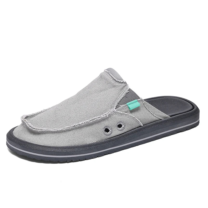 Gray canvas men's slip-on loafers with breathable low-top design and black sole