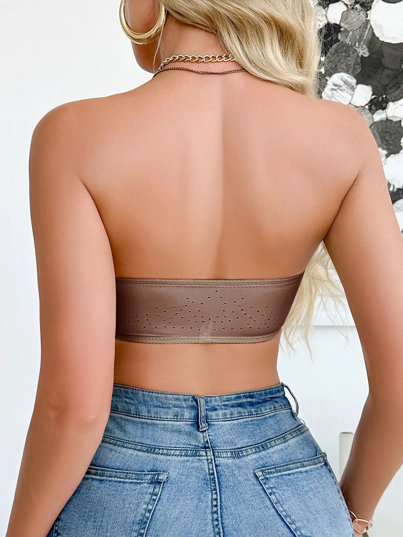 Strapless wireless bralette in taupe brown with perforated back band, back view.