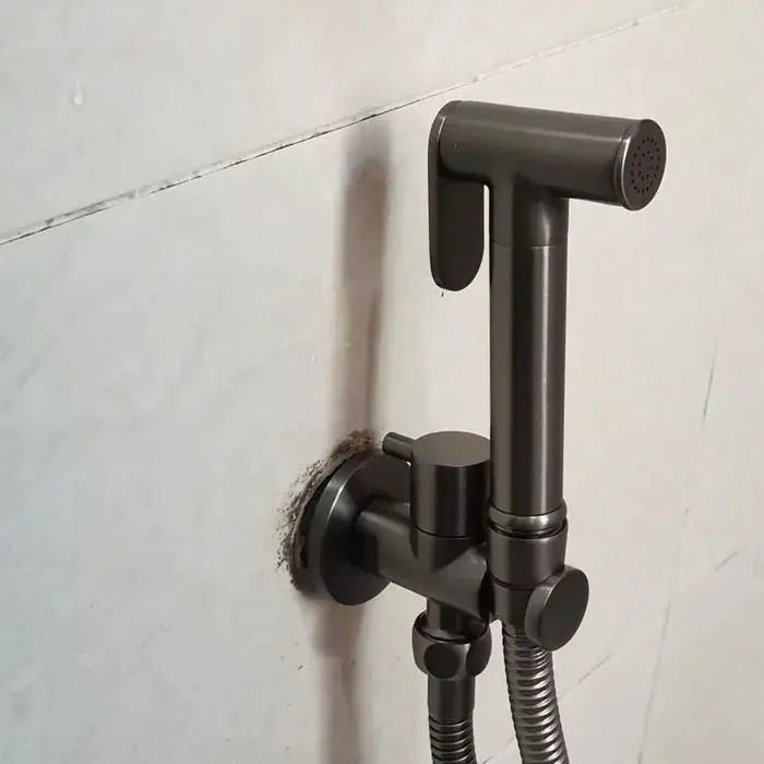 Black brushed metal handheld bidet shower set, wall-mounted with hose and spray head.
