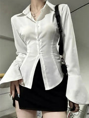 White women's button-front blouse with lapel collar and dramatic flared bell sleeves