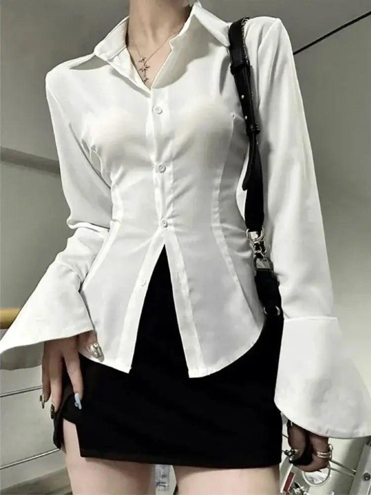 White women's button-front blouse with lapel collar and dramatic flared bell sleeves