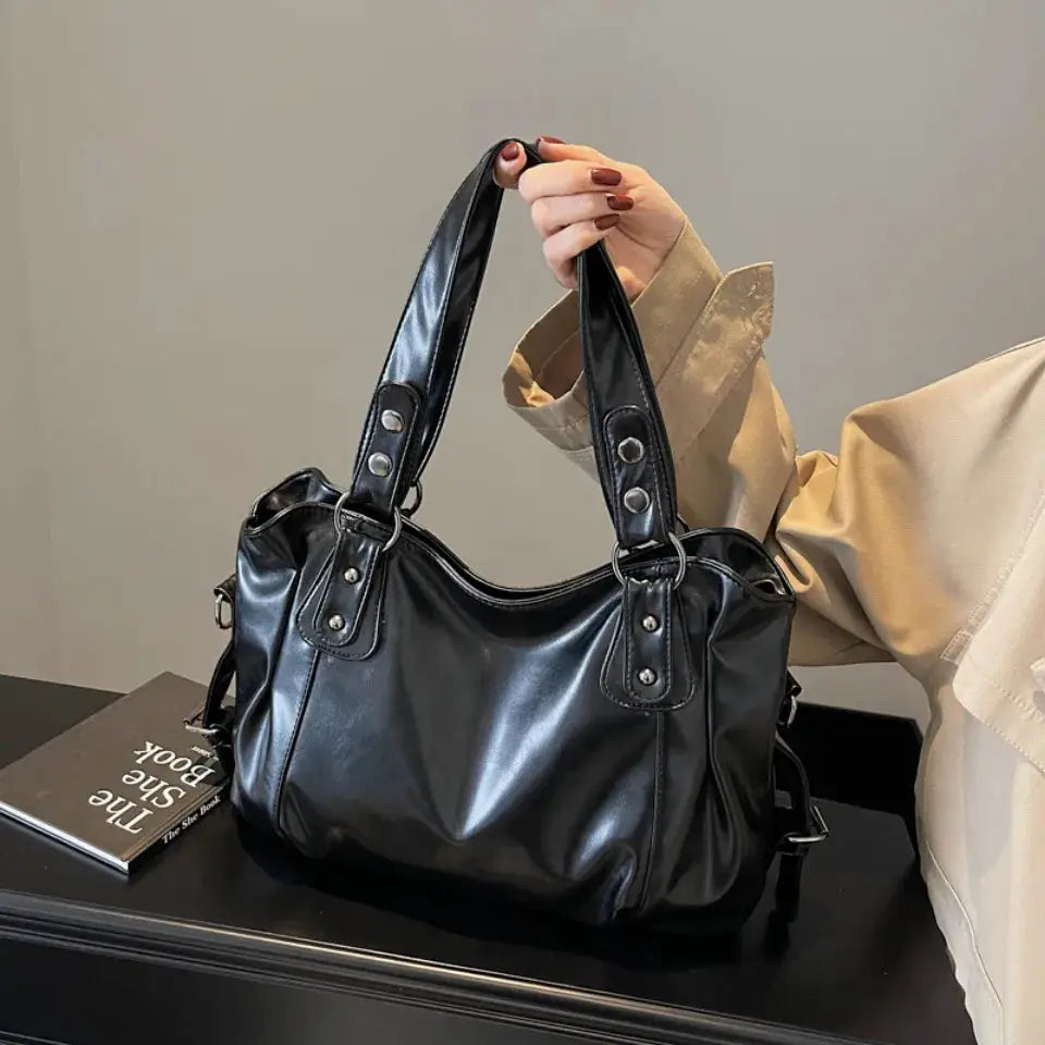 Black PU leather women's shoulder bag with double handles and metal rivets