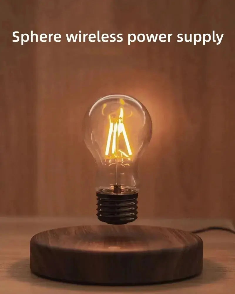 Simples Market magnetic levitation lamp with floating glass LED bulb and warm amber glow on a wooden base