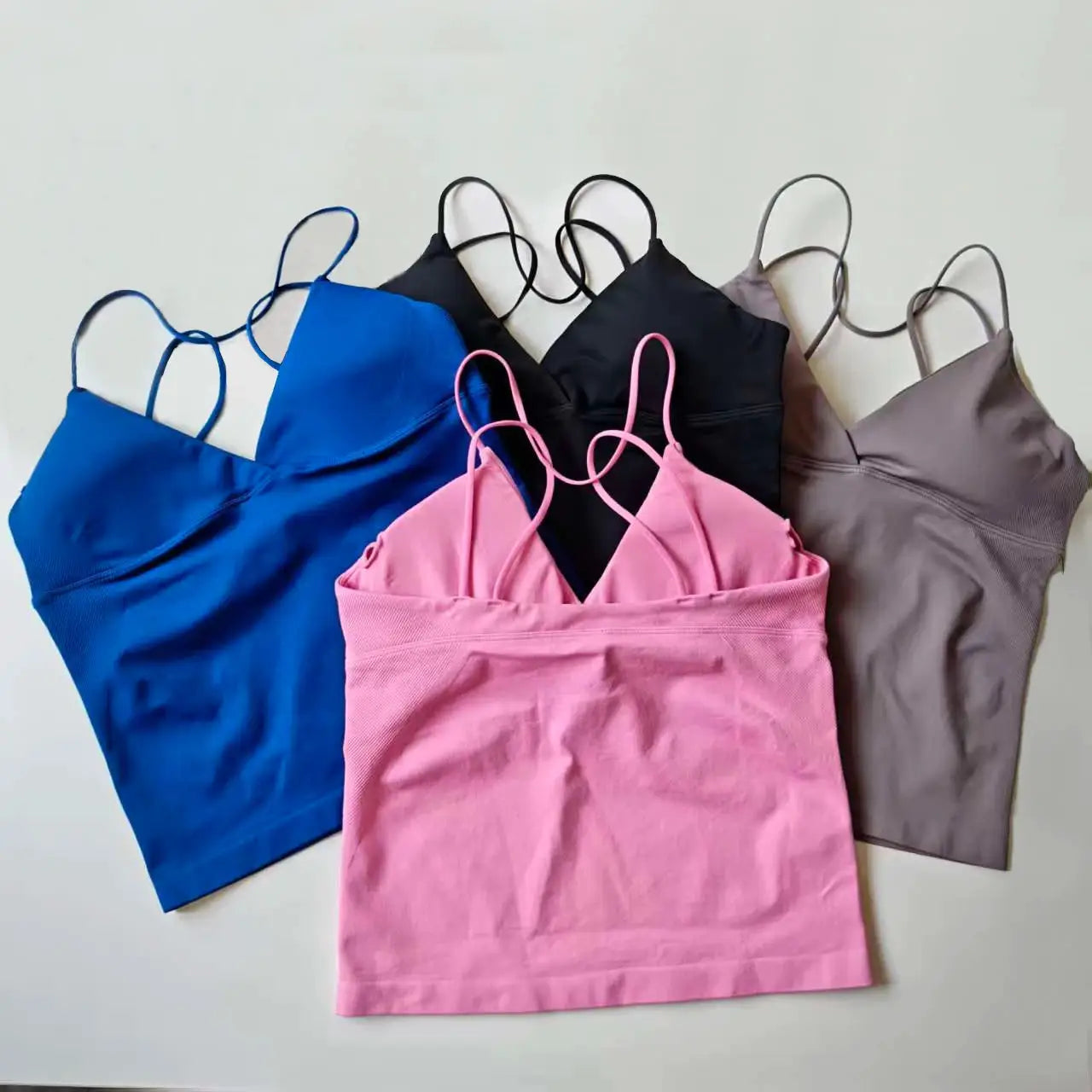 NCLAGEN Vision Twist Front Longline Top five-pack in blue, pink, black, gray, and taupe