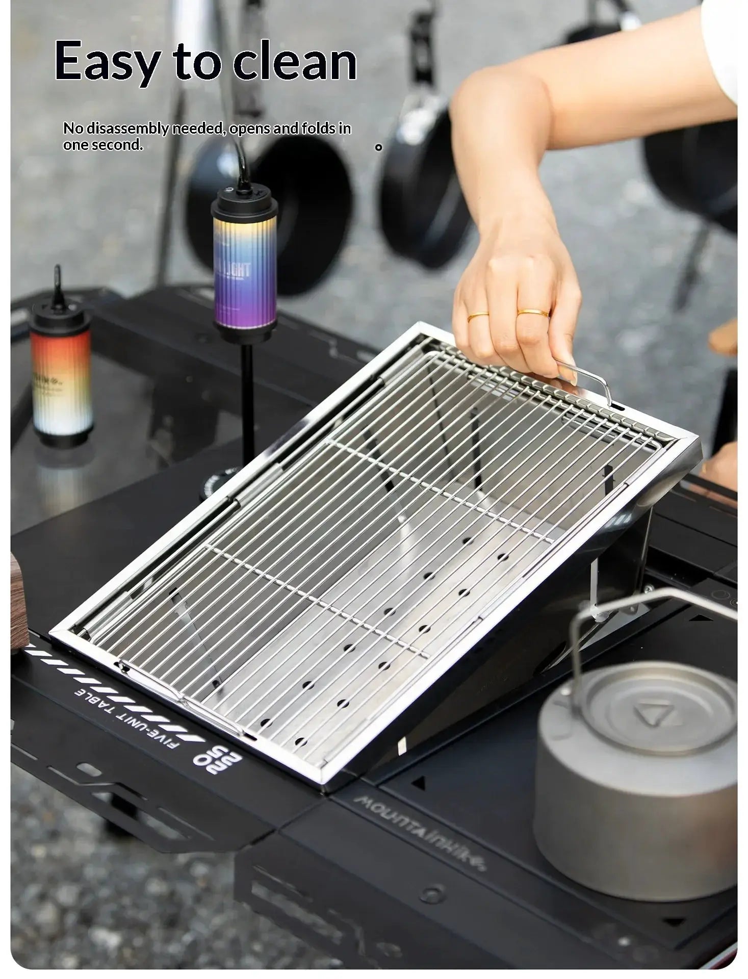 MOUNTAINHIKER 304 stainless steel portable BBQ grill on a folding outdoor stove.