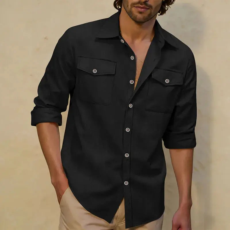 Men's black long-sleeve button-up shirt with two chest pockets and rolled cuffs