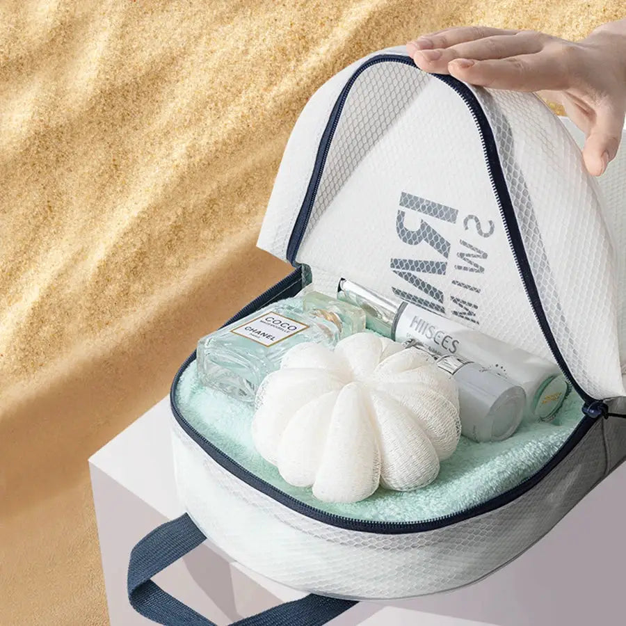 Simples Market XXL water-resistant sports duffel; white mesh with navy zipper opened to reveal toiletries and towel.