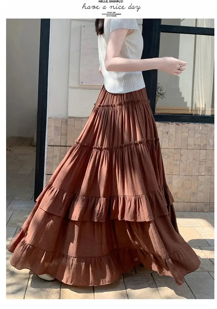 Tiered ruffle-hem maxi skirt in rust brown; Simples Market, high-waist, flowing A-line