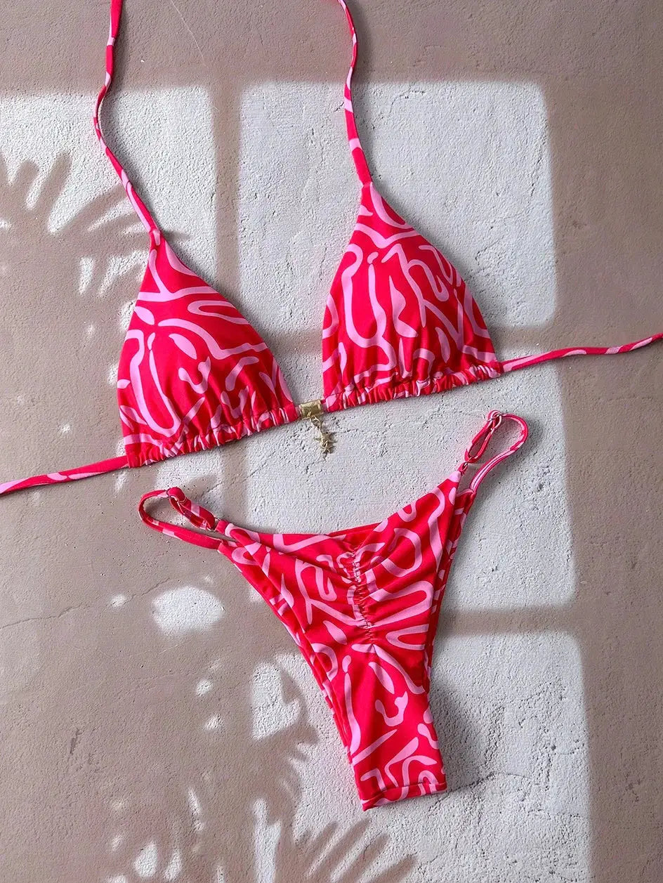 Pink abstract-print two-piece bikini set with triangle top and thong-style bottoms; adjustable straps, Simples Market