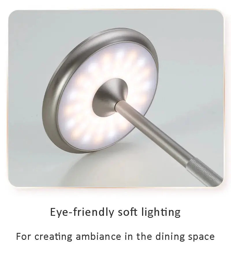 Wireless decorative table lamp by Simples Market; metallic silver circular LED disk with touch dimming