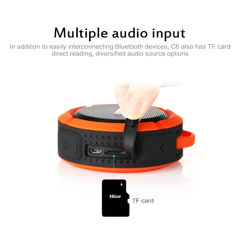 Waterproof wireless portable Bluetooth speaker with orange rim, round black body, and TF card slot, by Simples Market