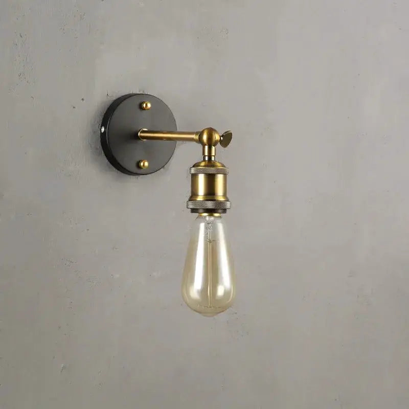 Simples Market American single head wall lamp, industrial brass with black round backplate and Edison bulb.