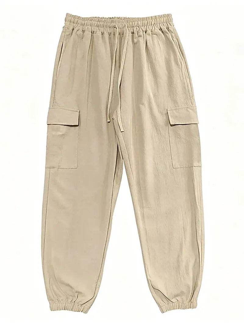 Men's cargo jogger pants in beige cotton-linen blend with elastic waist, drawstring, and multiple pockets.