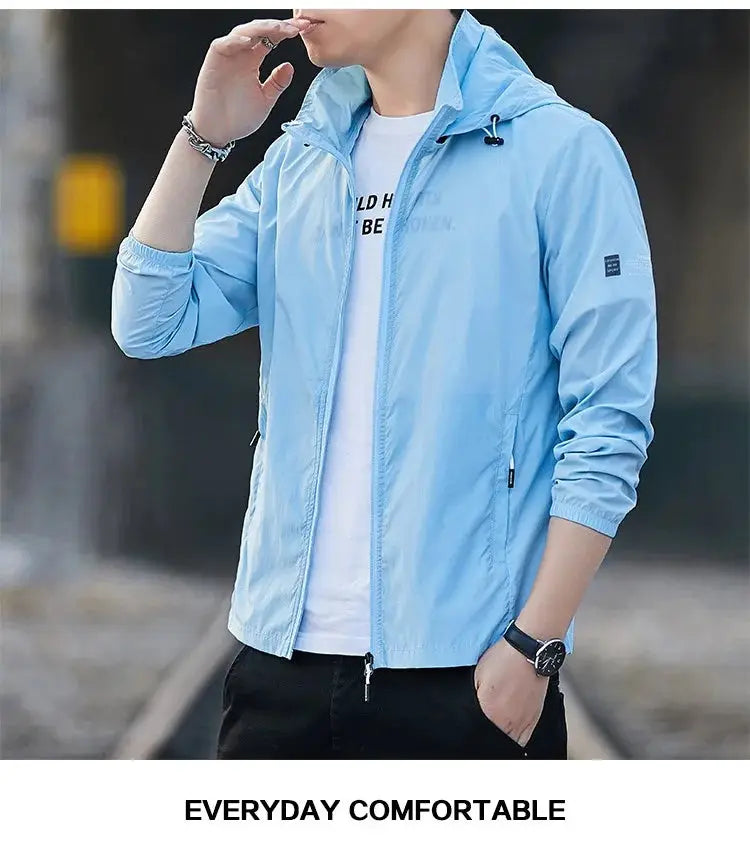 Sun protection windbreaker jacket with hood by Simples Market in light blue, lightweight and breathable.