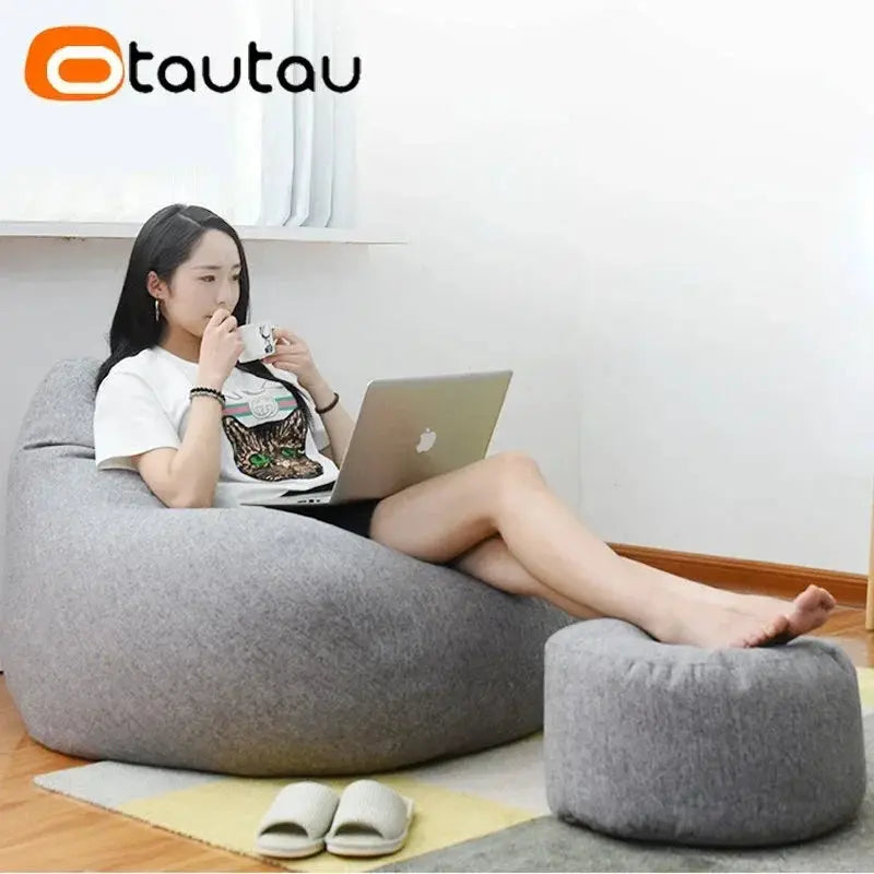 OTAUTAU linen bean bag chair with grey fabric and matching round ottoman.
