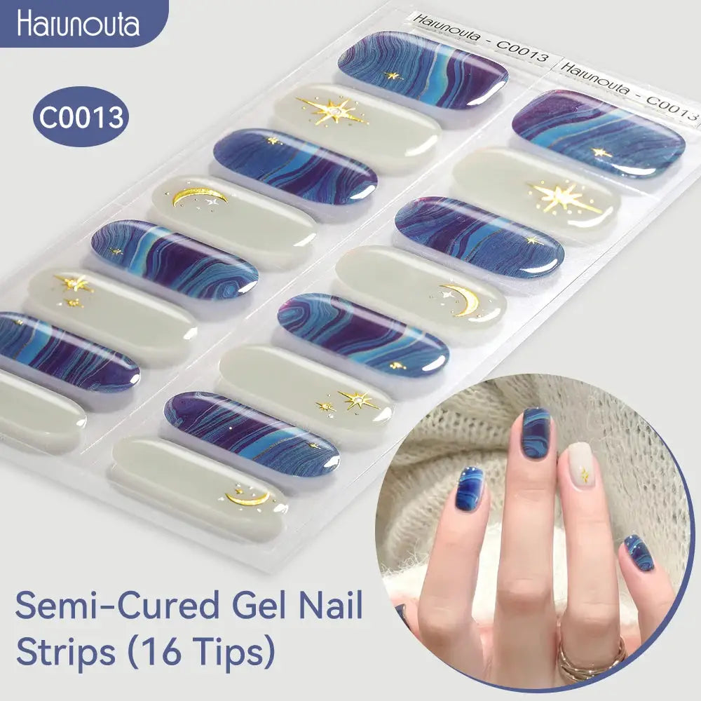 Gel nail strips Gradient Auroras by Simples Market; Haunouta C0013 packaging, 16 blue-purple marbled tips with gold stars.
