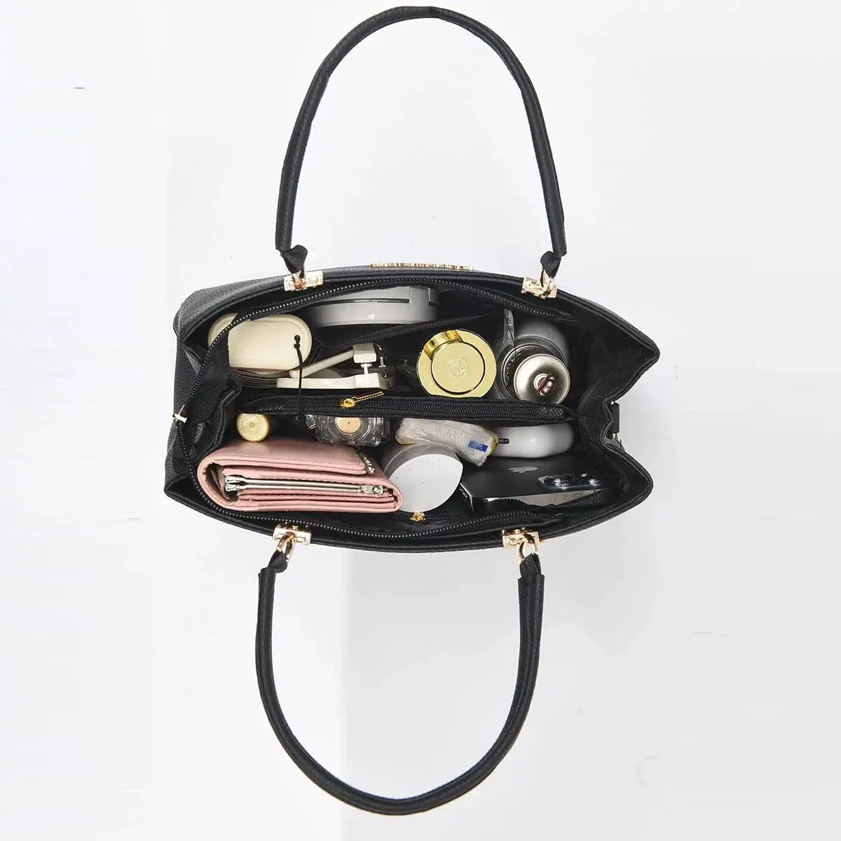 Black bow-style shoulder bag with gold hardware, large capacity opened to reveal cosmetics and wallet inside