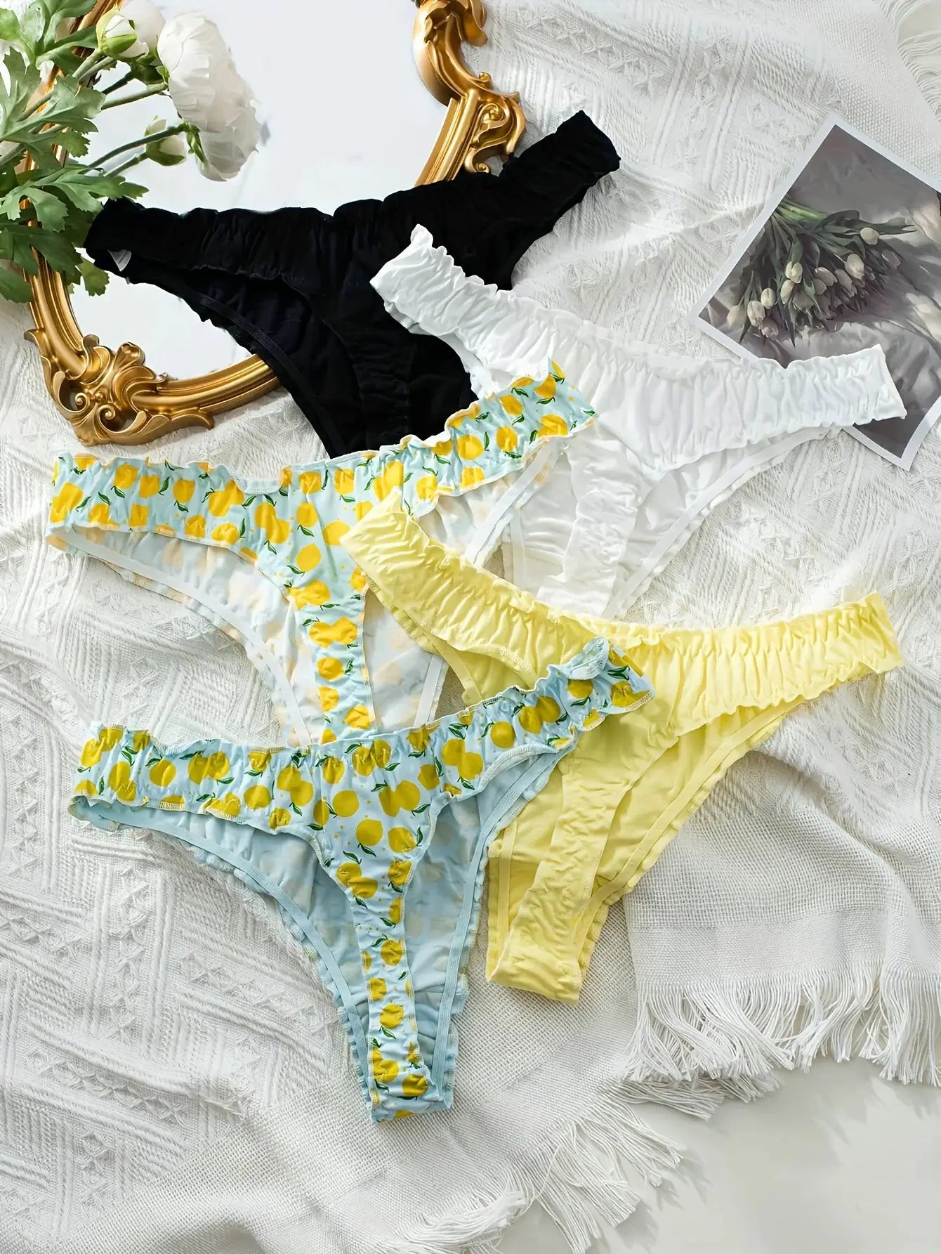 5-piece mixed fruit-pattern cotton ruffled thong underwear set in black, white, blue lemon-print, and yellow.