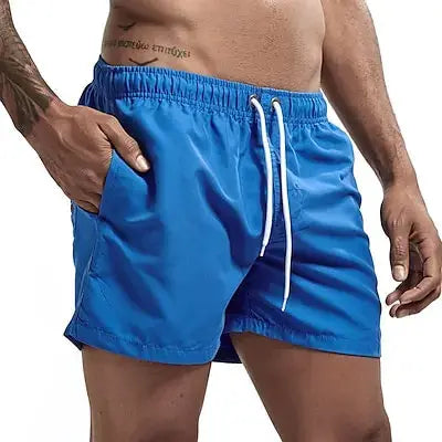 Men's blue swim trunks with white drawstring, quick-dry board shorts with pockets for beach and surf