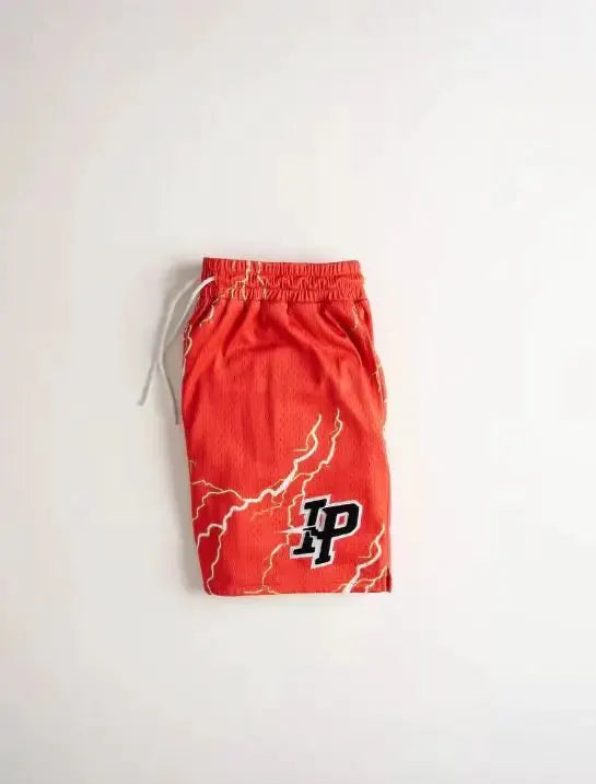 Men's red shorts with white drawstring, lightning print, and LP logo.