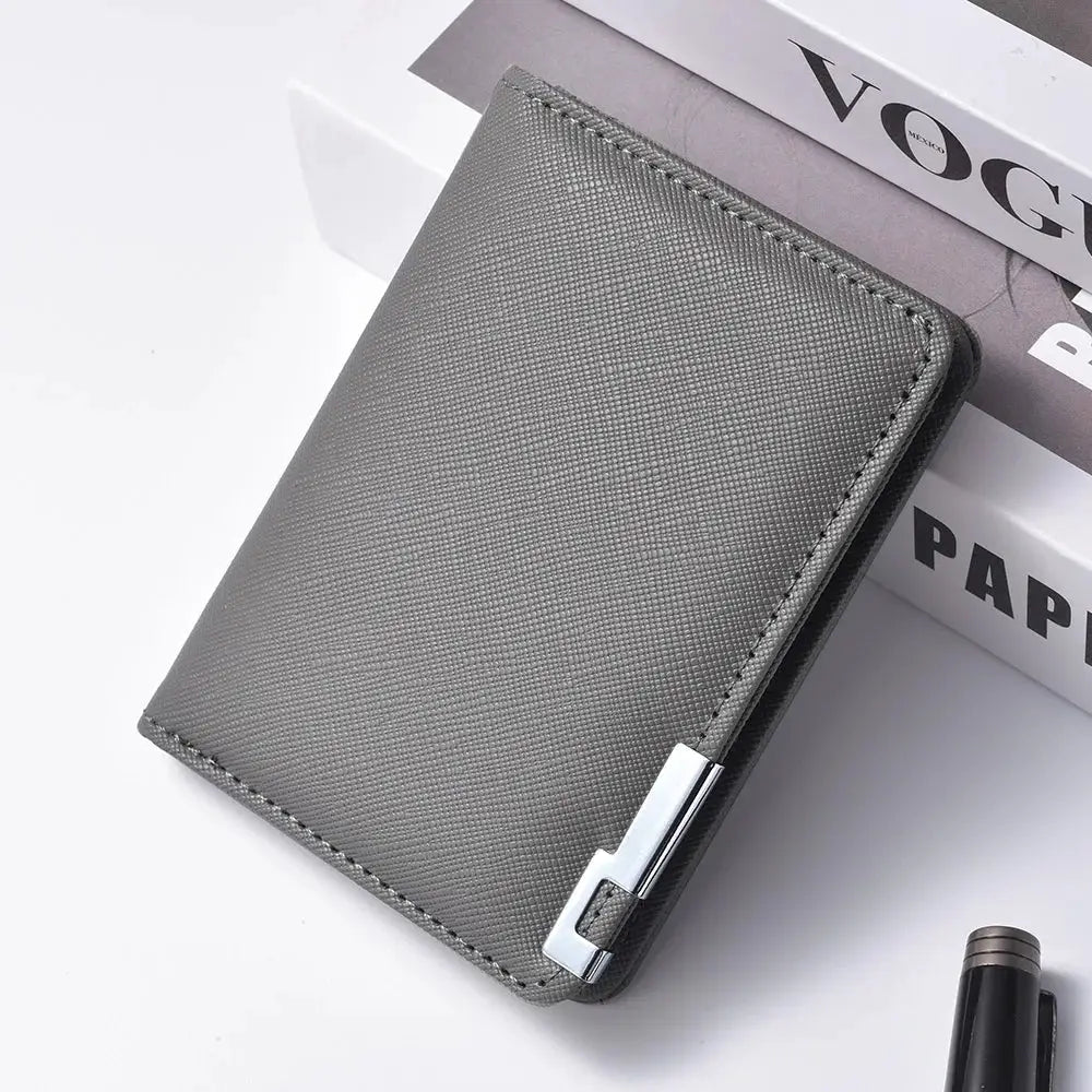 Grey faux-leather small slim business-style wallet with metal accent.