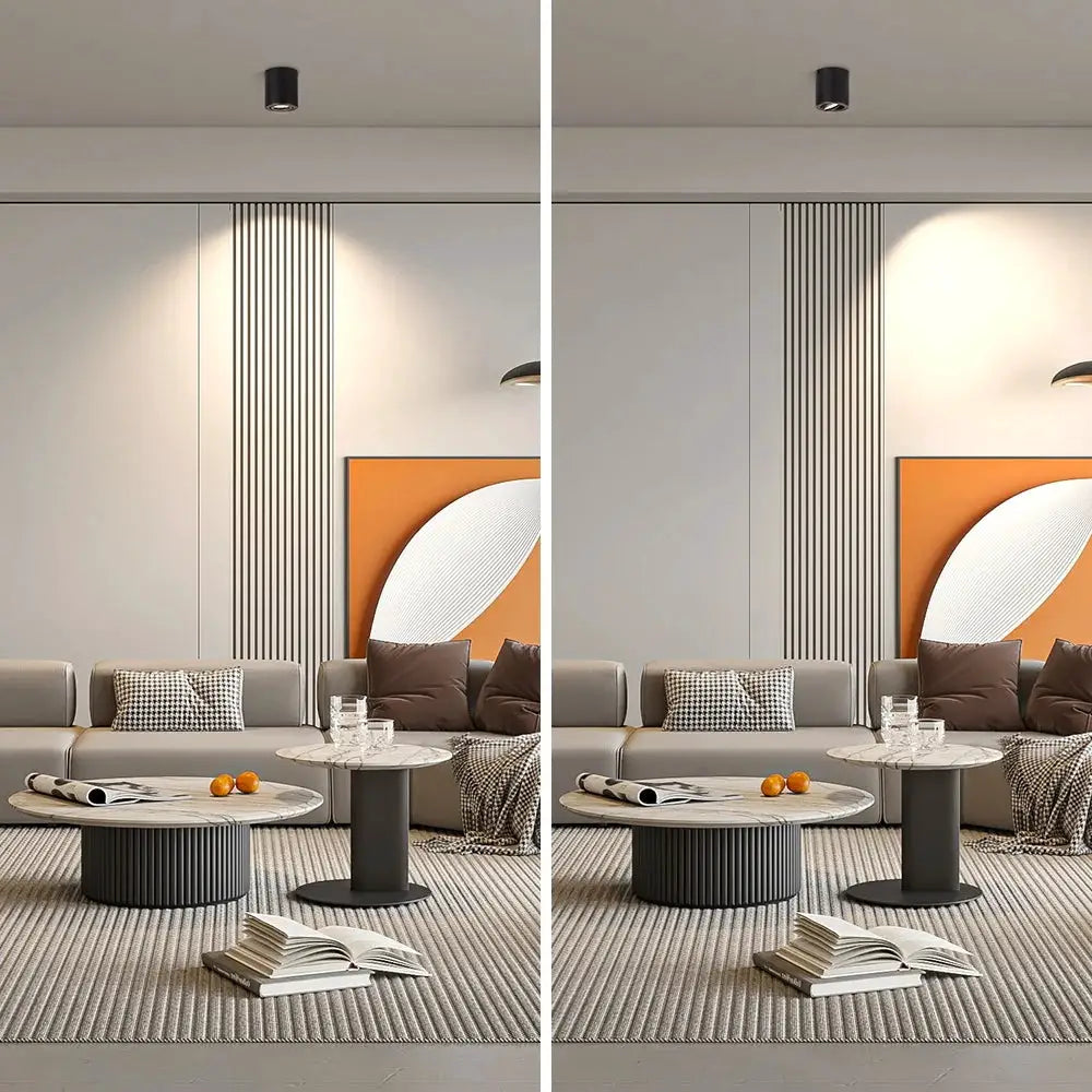 Replaceable GU10 LED downlights; two black ceiling spotlights in a modern living room.