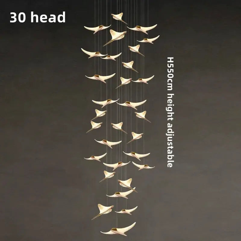 Seagull staircase pendant lamp with 30 gold-toned bird pendants, long adjustable hanging fixture for modern interiors