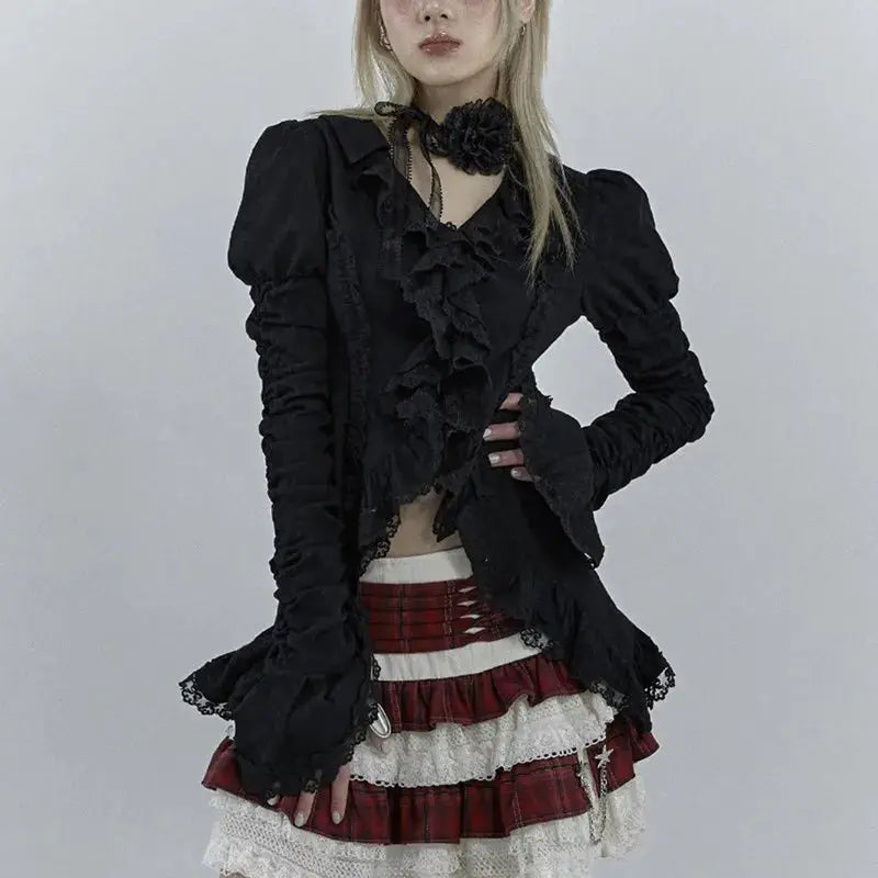 Karrcat Gothic black lace shirt with V-neck and ruffled front, puff sleeves; paired with red plaid lace-trimmed skirt.