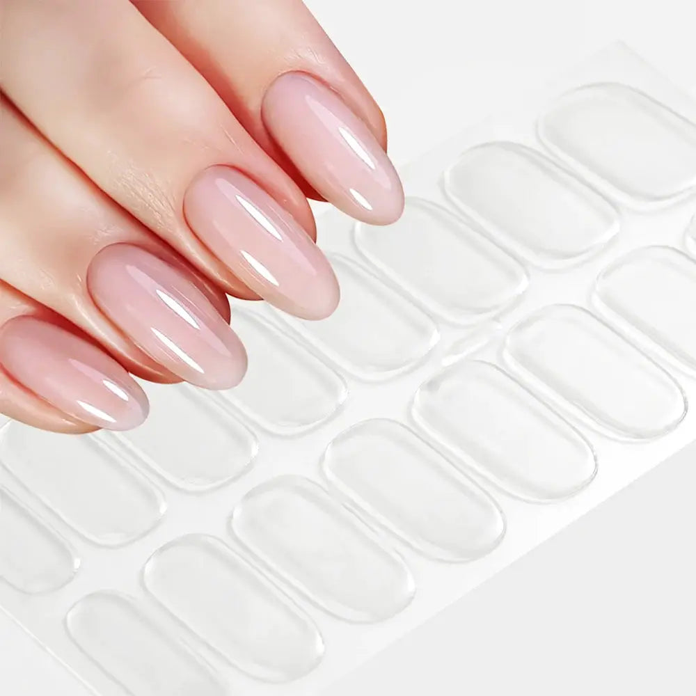 Nail sticker sheet for French manicure; 16 tips, clear full-coverage decals shown on pink nude glossy nails