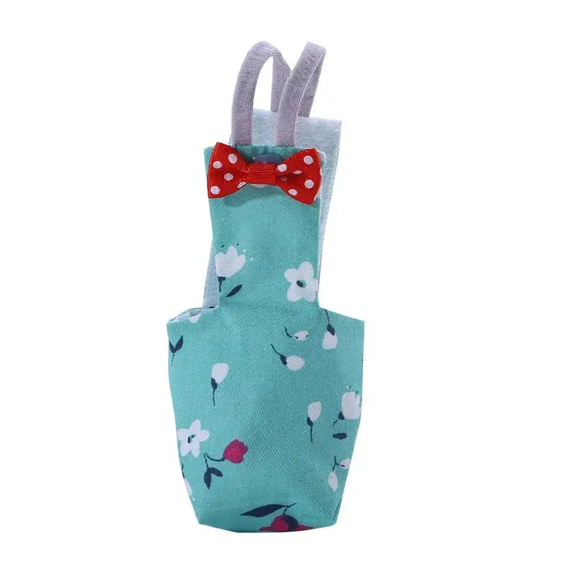 Parrot diaper with bowtie in teal floral fabric with red polka-dot bow, washable