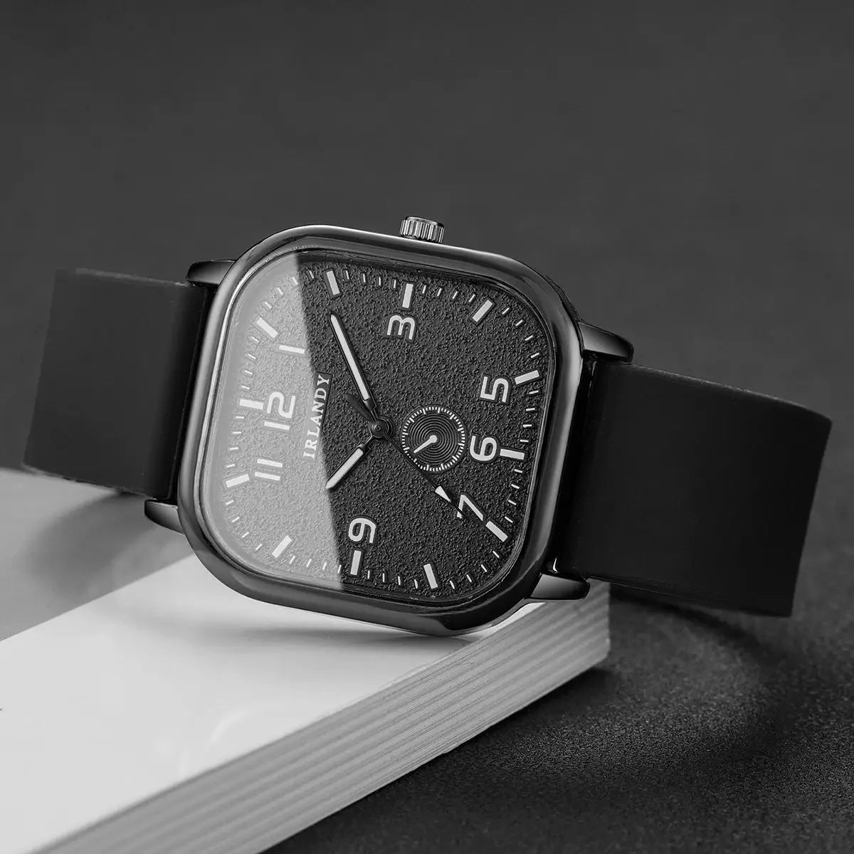 Square-faced IRLANDY watch with black textured dial and silicone strap