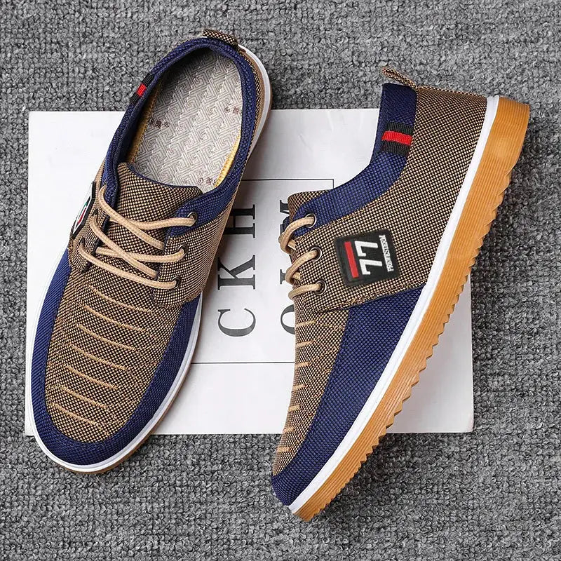Pair of men's knitted casual sports shoes by Simples Market in tan and navy with gum sole and side logo patch