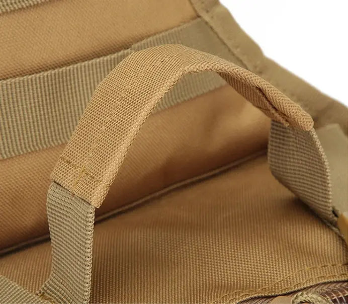 Tactical sling bag in tan, small crossbody daypack with MOLLE for outdoor camping and hiking.