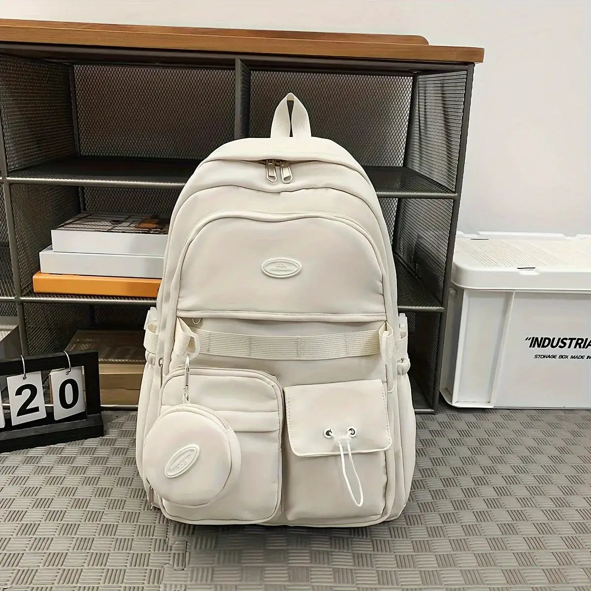 Simple Large Capacity Sports Travel Backpack by Simples Market in white with multiple pockets and a round front pouch.