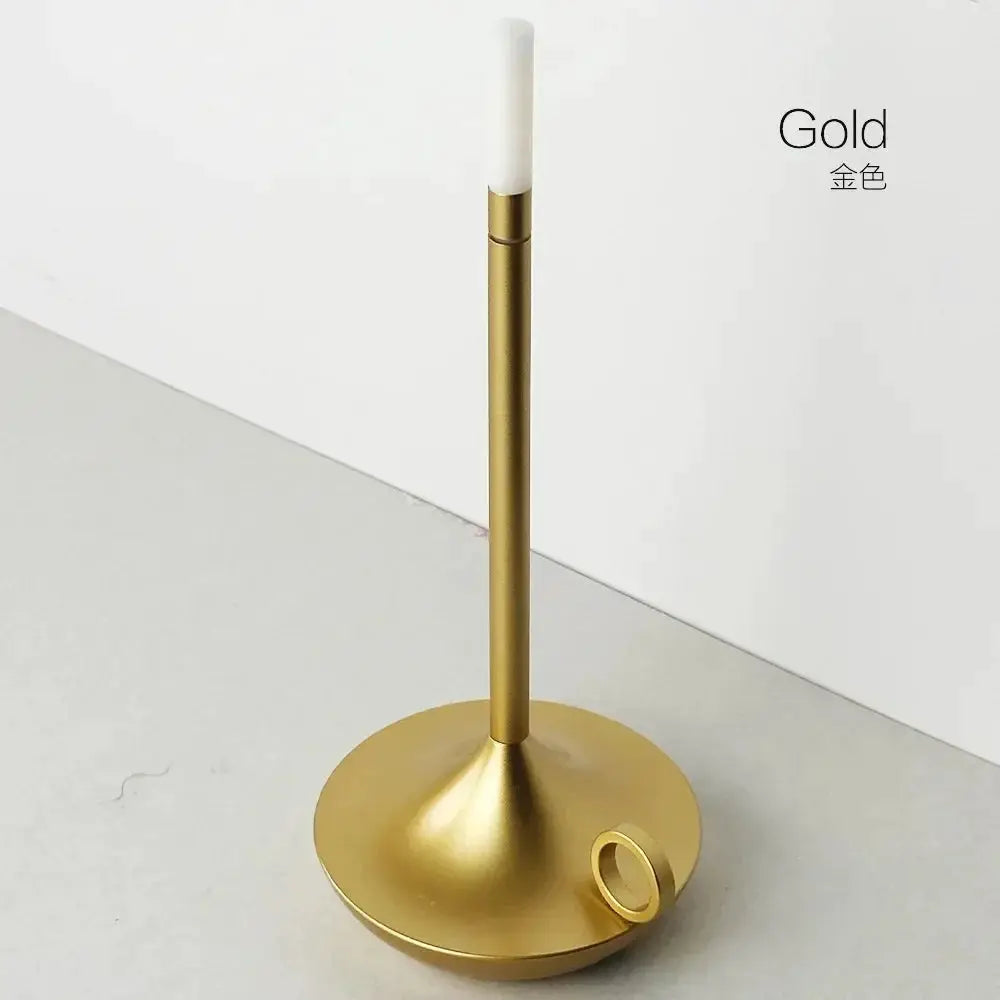 Atmosphere LED candle lamp in gold with white LED candle on a round base; USB charging desk decor