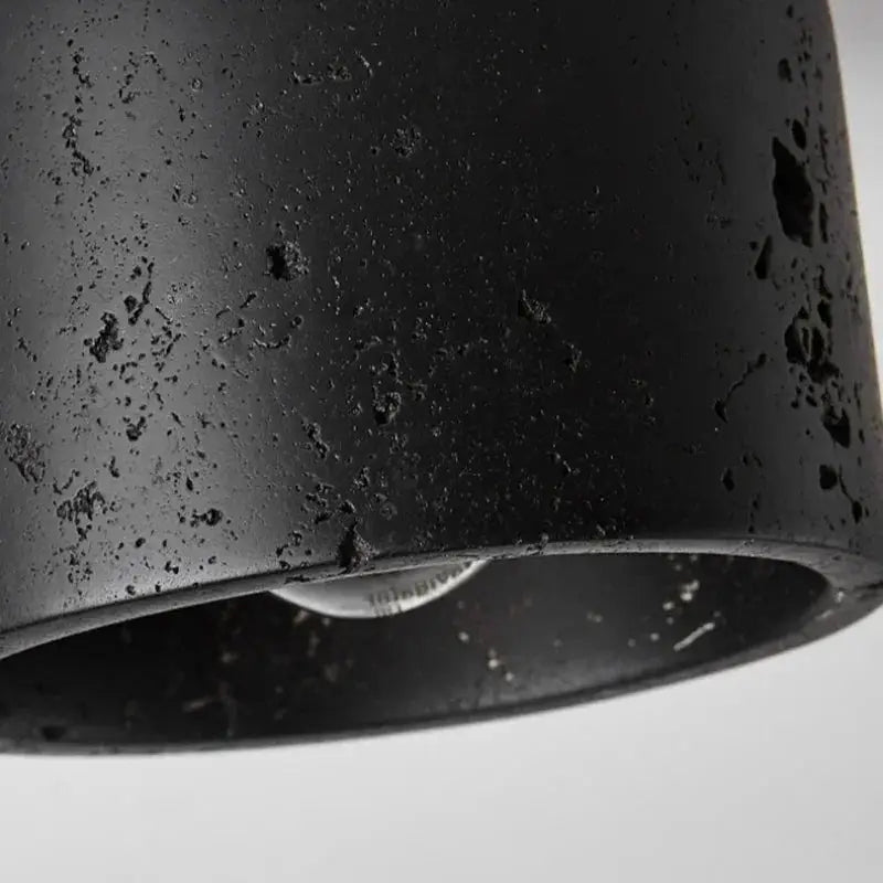 Wabi-sabi black ceiling lamp with rugged cave-stone texture for home corridor decor