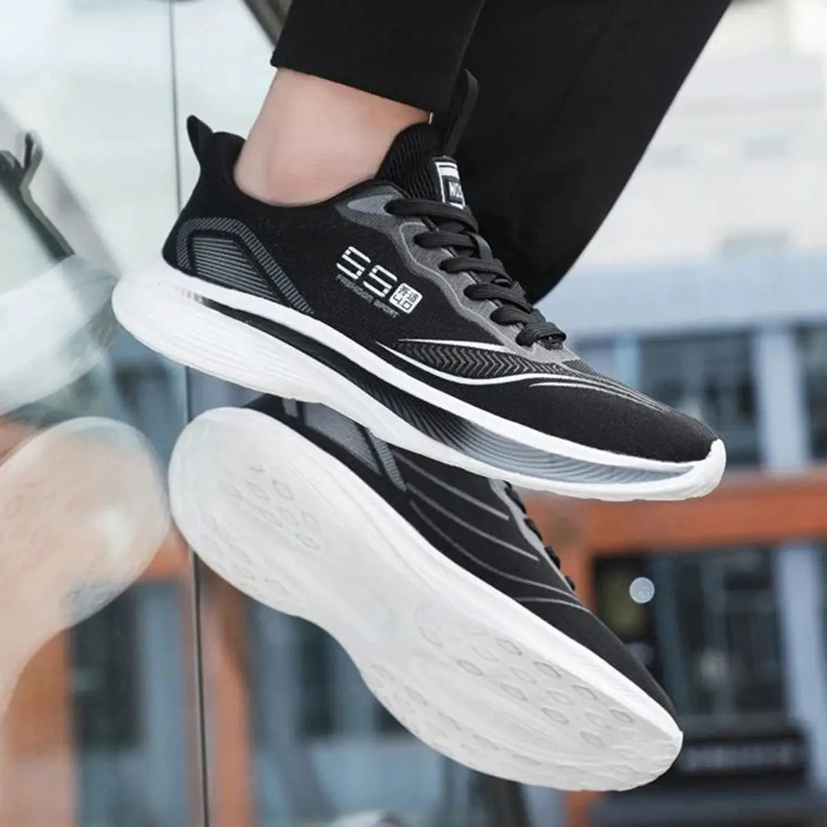 Men's running shoes by Simples Market, black with gray accents and white sole