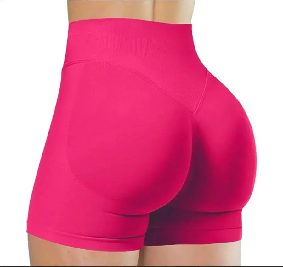 Women's seamless high-waist gym shorts by Simples Market in hot pink, butt-lifting for yoga and workouts
