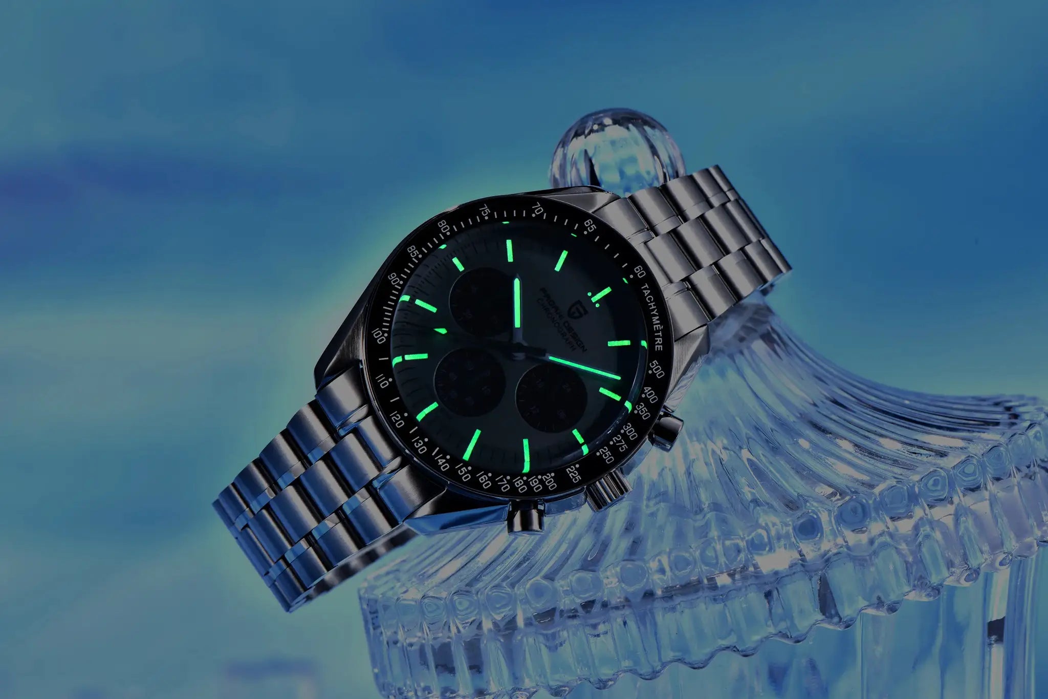 Pagani Design 500 sport chronograph watch on stainless steel bracelet with green luminous markers.