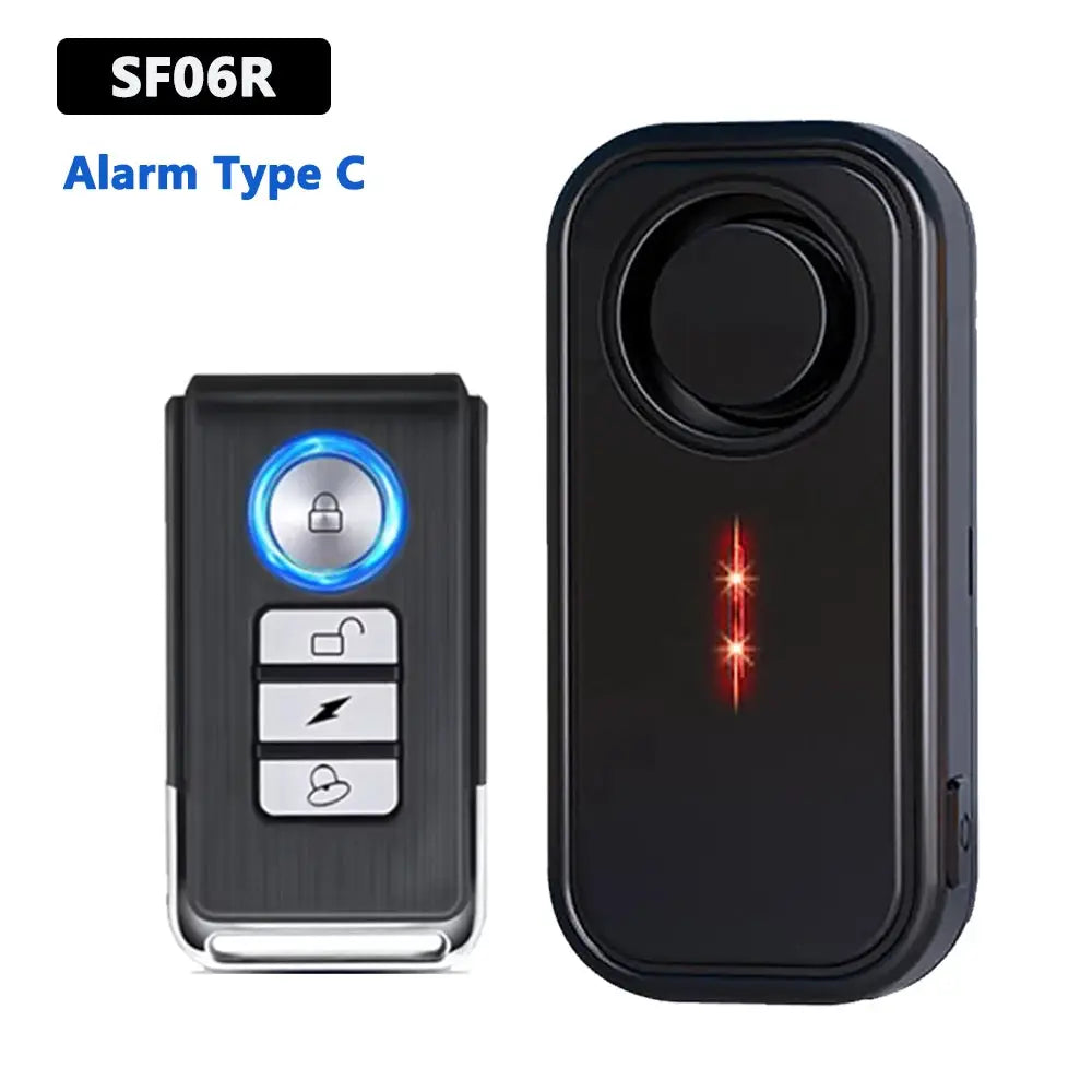 Awapow wireless vibration alarm remote and receiver set, black with blue ring button and 3 white function buttons.