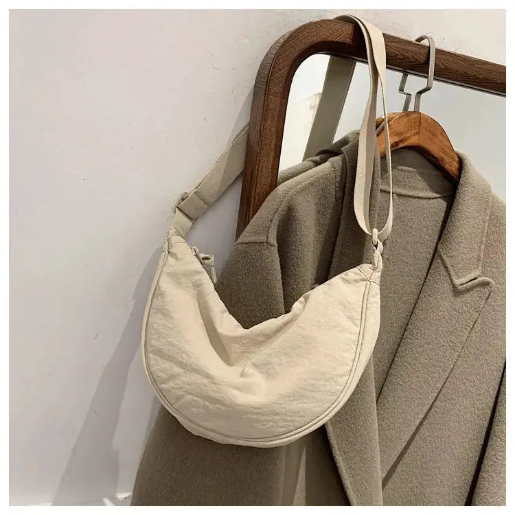 Casual beige nylon hobo crossbody bag with adjustable strap, large-capacity women's shoulder purse.