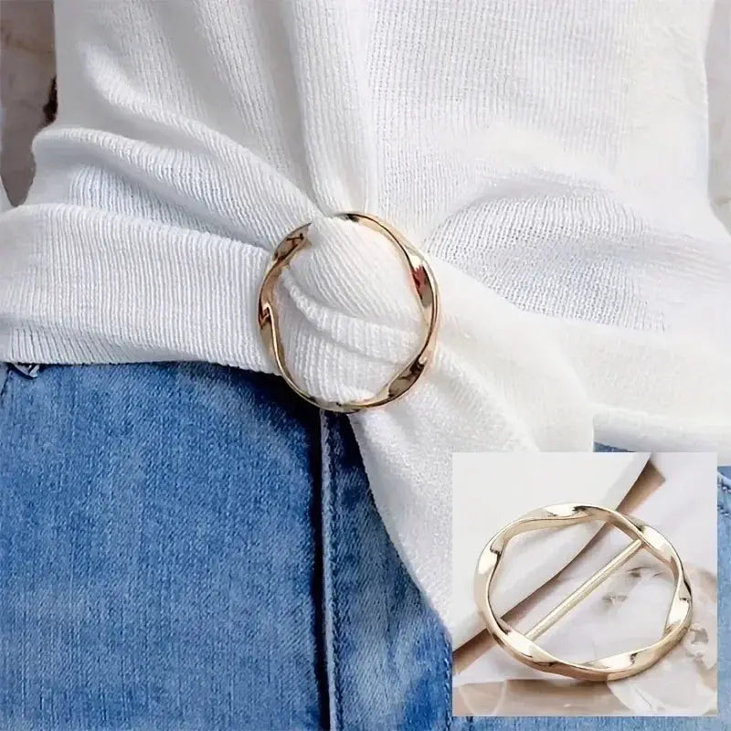 Gold metal round circle clip by Simples Market worn as a shawl clip on a white knit sweater