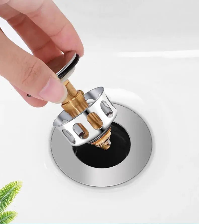 Bathtub drain pop-up stopper by Simples Market; metal, silver finish, hair catcher.