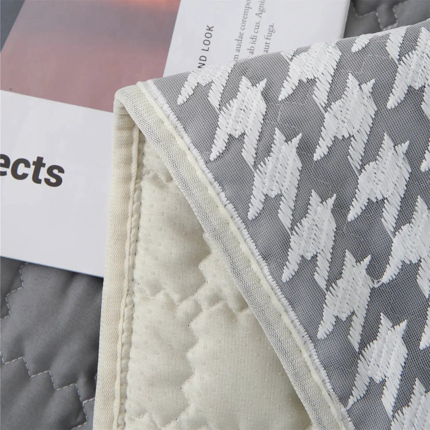 Sofa cushion cover by Simples Market; grey/white houndstooth quilted lace with anti-slip beige backing