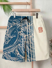 Men's swim shorts with blue Japanese wave print panels and white side panel, drawstring waist, casual street style